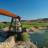 A view of a hole surrounded by water at Laughlin Ranch Golf Club.