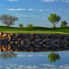 A view over the water of a hole at Encanterra Country Club.