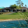 A view over the water of the clubhouse and putting green at Rio Salado Golf Course