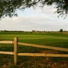A view over the fence of the 16th green at Bear Course from Bear Creek Golf Complex