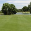 A view of a green with water coming into play at Country Club of Green Valley