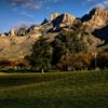 A view of a hole with mountains in the distance at Oro Valley Country Club