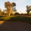 A sunset view of a hole at Shalimar Golf Club