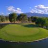 A view of green #14 surrounded by water at Mt. Graham Golf Course.
